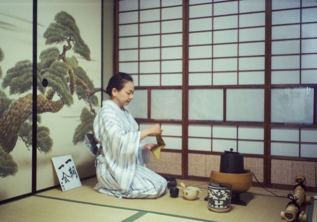 A host whisking matcha during a Japanese tea ceremony in Kyoto